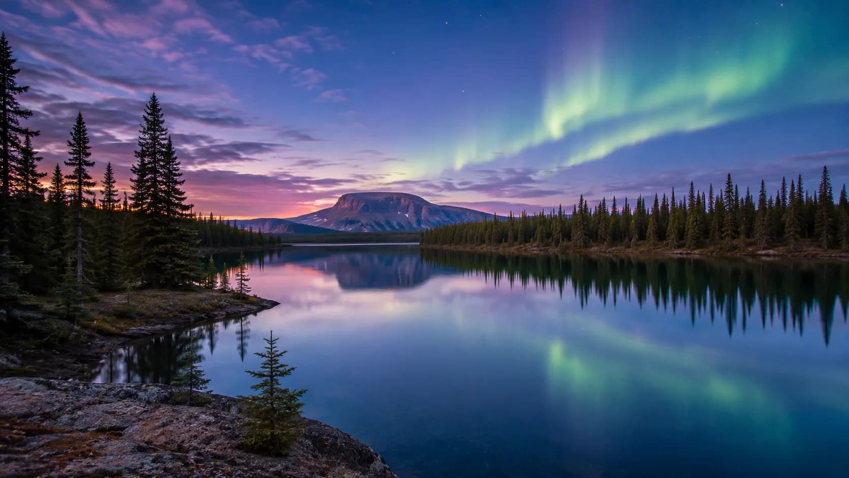 A subarctic lake in the Northwest Territories under the northern lights
